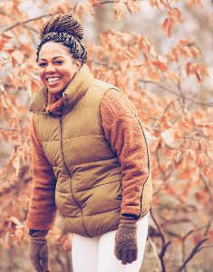 Picture of Brianna Mitchell in front of woods